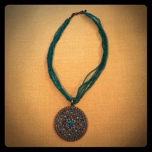 Beaded necklace with eye catching pendant